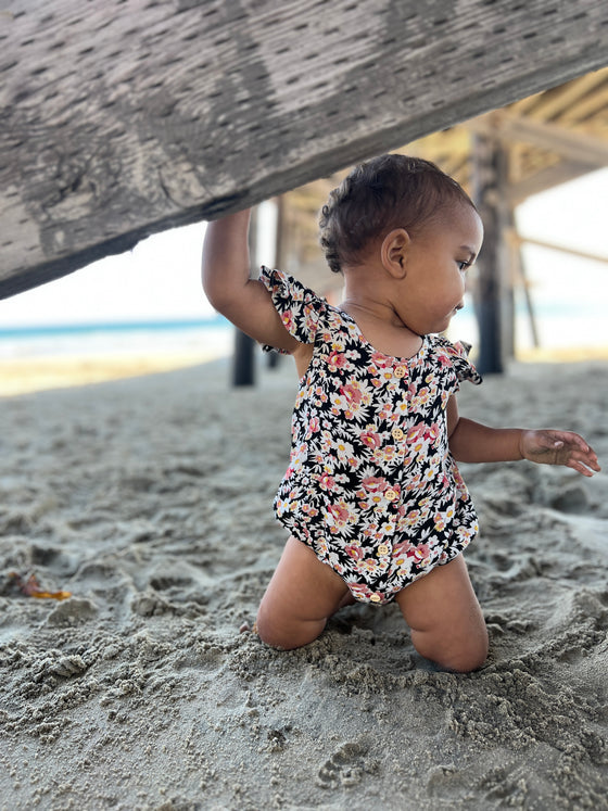 Pink and black floral baby bubble one piece 