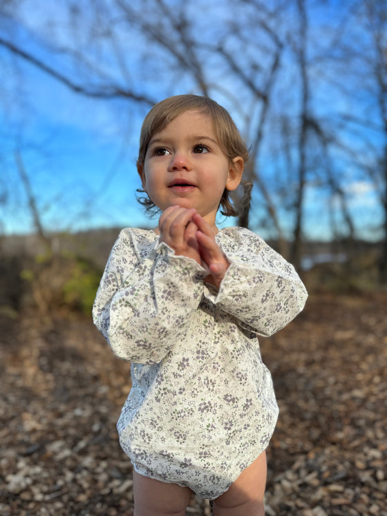 Baby Toddler wearing white and grey floral bubble