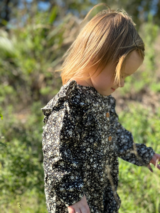 Toddler wearing black floral bubble in Midnight 