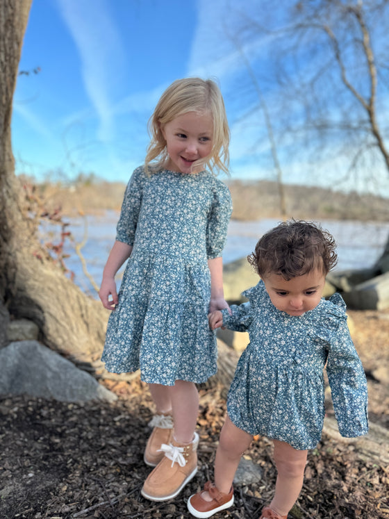 Sisters wearing blue floral bubble and Blue floral dress